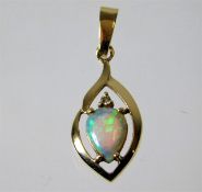 A 14ct gold pendant set with diamond and opal 1.4g