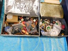 Two tins of assorted buttons