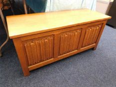 Large oak blanket box with linen fold decor