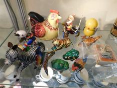 A quantity of tinplate clockwork toy items