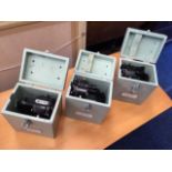 Three Royal Marine signalling lights with boxes