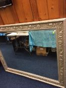 A silver coloured Morris mirror approx 48" x 44"