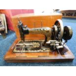 A Frister & Rossmann sewing machine with box and k