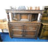 An antique oak court cupboard