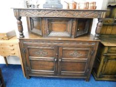 An antique oak court cupboard