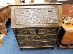 Stained pine bureau with carved Chinese figures