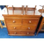 A late Victorian low level chest of drawers