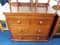 A late Victorian low level chest of drawers