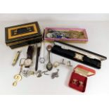 A quantity of miscellany items including a tin