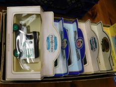 Six boxed die cast cars and buses and one other