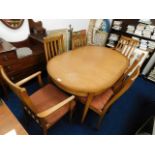 An extendable stateroom dining table and chairs