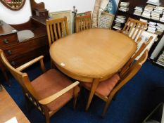 An extendable stateroom dining table and chairs