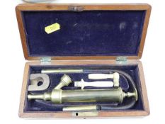 An early 20th Century boxed bladder syringe