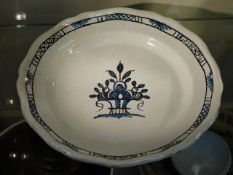 A large French Faience plate with brown glaze unde