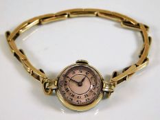 A vintage ladies gold plated wristwatch with facet