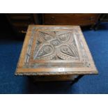 A low level table with carved oak top