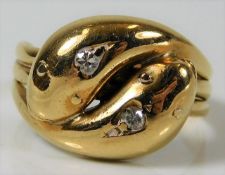 An antique snake ring, tests as 18ct gold, set wit