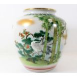 A Chinese porcelain jar with crane decor 8.75in ta