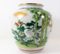 A Chinese porcelain jar with crane decor 8.75in ta