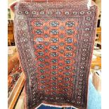 A Persian Bokhara rug approx 72" x 50