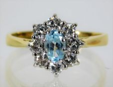 An 18ct gold ring set with aqua & pprox. 0.55ct di