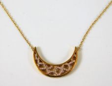 An 18ct gold symmetrical pendant set with approx.