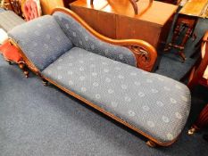 An upholstered Victorian mahogany chaise longue 64