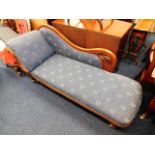 An upholstered Victorian mahogany chaise longue 64