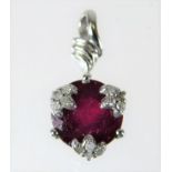 A 9ct white gold ruby pendant with diamonds 1.4g