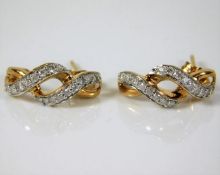 A pair of 9ct gold pair of diamond earrings 2.6g