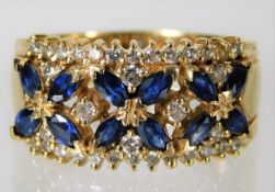 A 14ct gold ring set with sapphire & diamond 7.3g