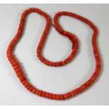 A Victorian string of coral beads 25in 51.7g