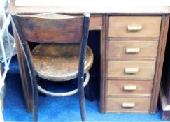 A small oak kneehole desk 35.5in wide with chair originally from the family home of artist Peter Lan