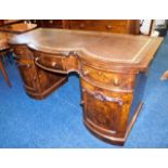 A serpentine style fronted desk with burr walnut &