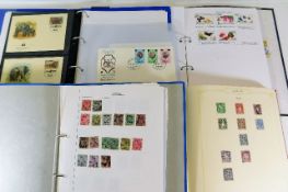 Four stamp albums including Africa, North Korea, I