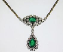 An impressive 18ct white gold necklace set with em