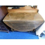 An oak Titchmarsh & Goodwin 18thC. style oak drop leaf table