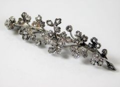 A 9ct white gold brooch set with over 40 diamonds