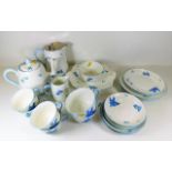 A Heathcote Williamsons art deco tea set, crack to