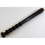 An early 20thC. walnut police baton 15in long