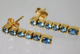 An 18ct gold earrings set with topaz 3.7g