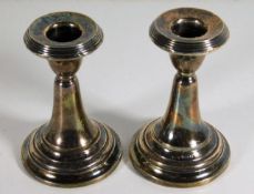 A pair of silver candlesticks 4in tall datemark fo