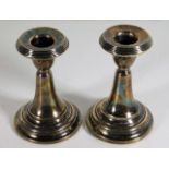 A pair of silver candlesticks 4in tall datemark fo