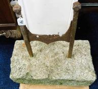 An antique granite boot scraper