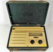 A vintage Vidor radio with case