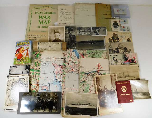 A selection of postcards, war time maps, wrestling