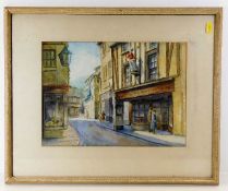 A framed watercolour of antiques shop in Looe, ima