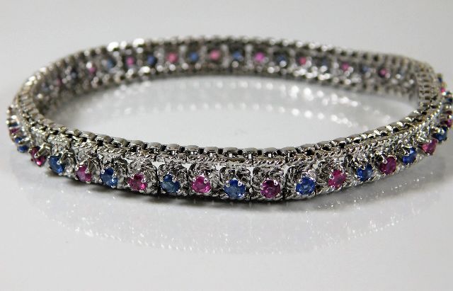 An 18ct white gold bracelet set with sapphire & ru