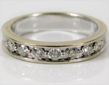 An 18ct white gold half eternity ring set with 0.5