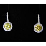 A pair of 18ct white gold earrings set with white